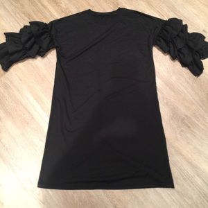 Lots of ruffles Ruffled sleeves dress. modest.